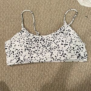 Black and white polka dot swimsuit top.